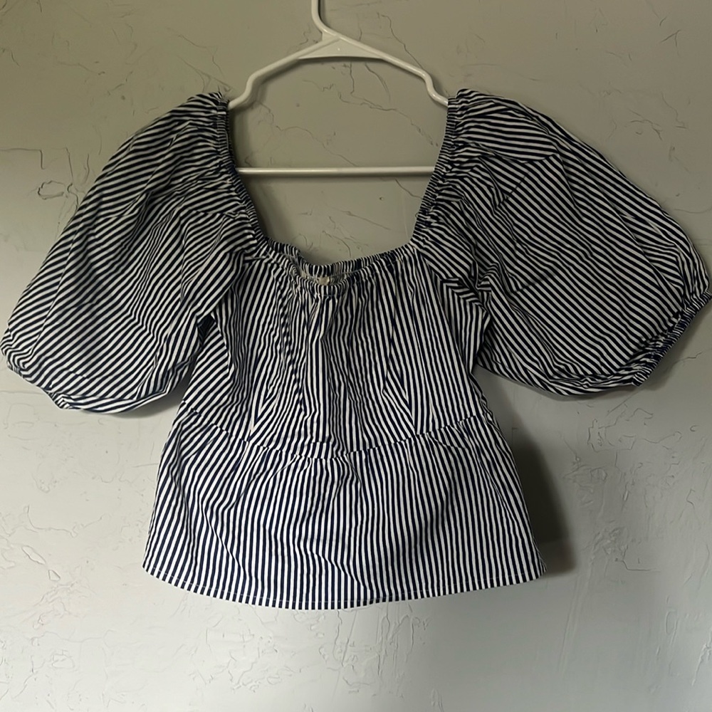 From sim and Sam, size: medium, and color is a blue and white striped shirt.